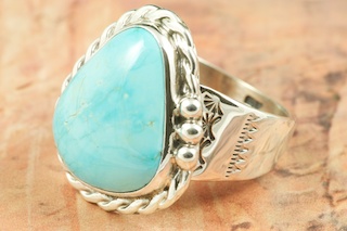 Genuine Hachita Turquoise set in Sterling Silver Ring. Created by Navajo Artist tony Garcia. Signed by the artist. The Hachita Turquoise Mine is located in southern New Mexico. It was mined from pre-historic times to 1905. The name 